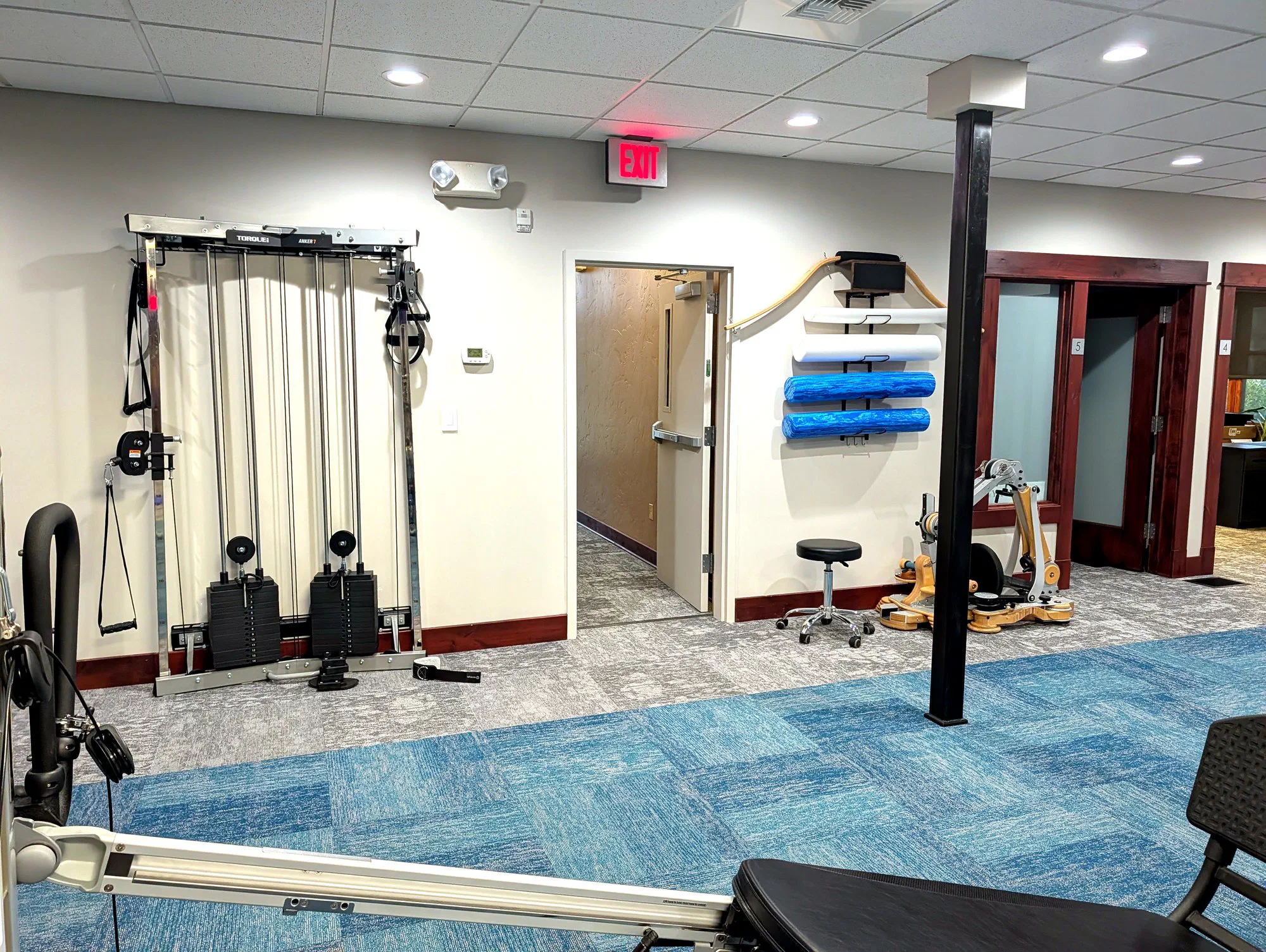 Rehabilitation gym with cable resistance equipment at Root Therapy and Wellness in Bozeman, Montana
