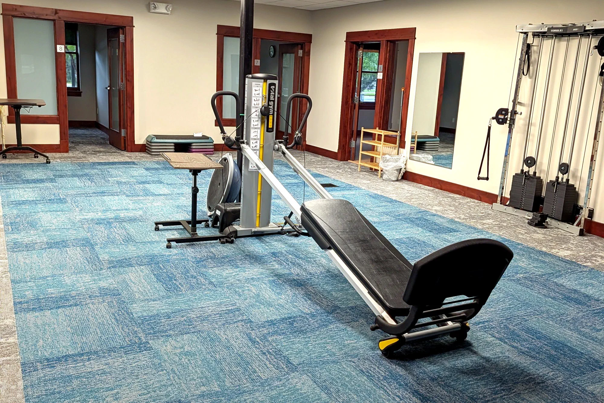 Open rehabilitation gym floor at Root Therapy and Wellness in Bozeman, Montana, where post-surgical rehab programs run