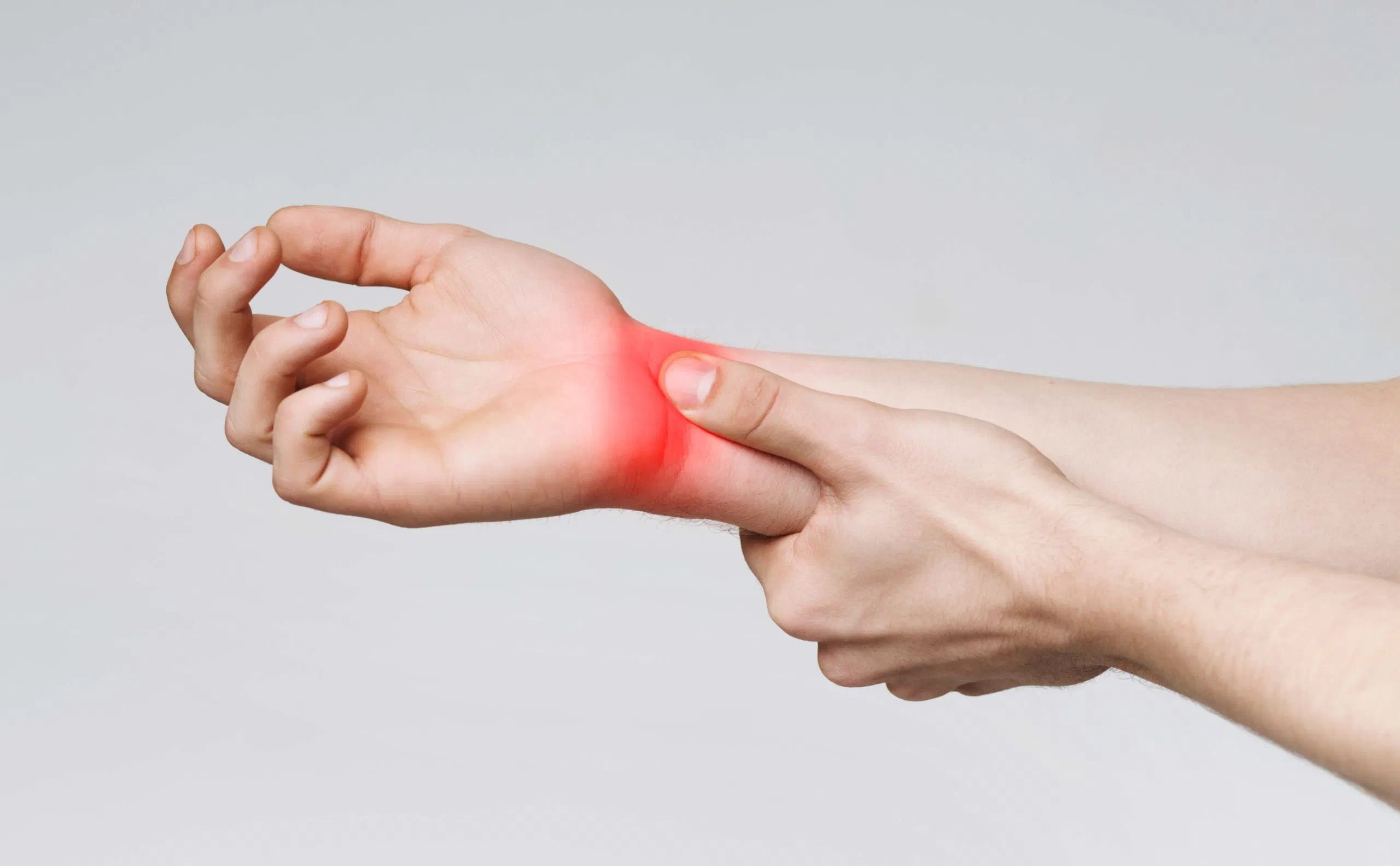 Occupational therapist treating carpal tunnel syndrome with hands-on wrist care at Root Therapy and Wellness in Bozeman, Montana