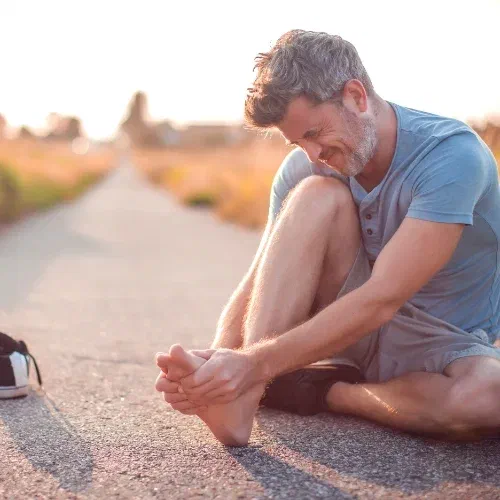 Physical therapist providing hands-on manual therapy for plantar fasciitis at Root Therapy and Wellness in Bozeman, Montana